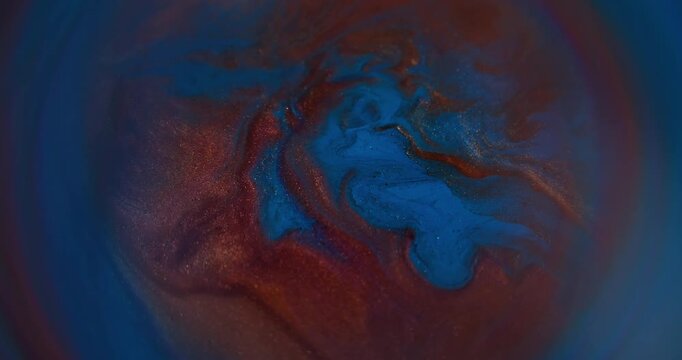 Blur glitter splash. Marble mix texture. Blue orange color shiny round fluid ink rainbow acrylic pigment sparkling water spatter on abstract art background.