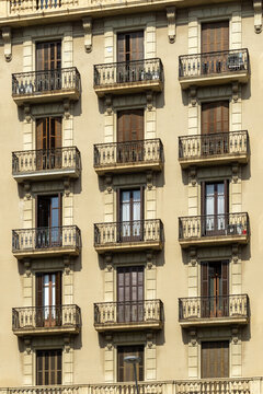 Barcelona building facade with classic balconies and windows