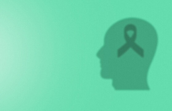 World Mental health day concept. human head and mental health ribbon shadow on green background.