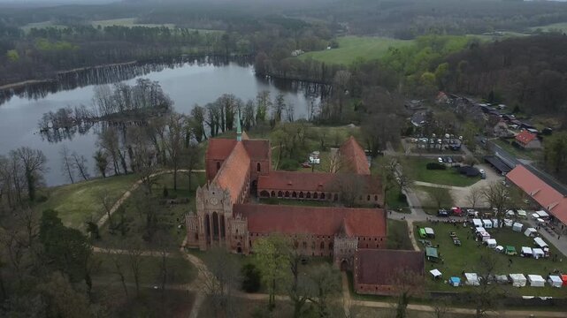 Aerial View of Medieval Chorin Abbey by Lake in Germany