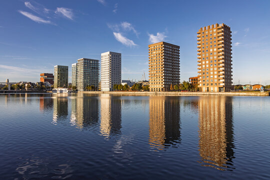 Antwerp, Belgium: Beautiful water reflection of the modern residential apartment towers in the Eilandje district of Antwerp, a trendy redeveloped port area with contemporary architecture.
