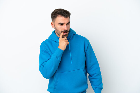 Young caucasian man isolated on white background nervous and scared