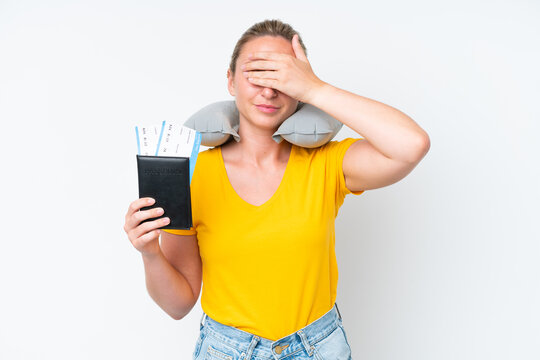 Woman with Inflatable Travel Pillow covering eyes by hands. Do not want to see something