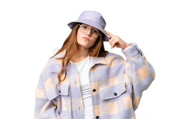 Fototapeta premium Teenager girl over isolated chroma key background having doubts and with confuse face expression