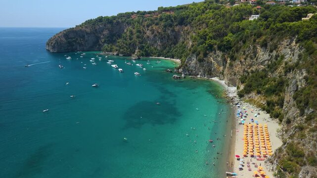 Marinella Beach Buondormire Bay Palinuro Cilento Italy aerial drone flyover panorama turquoise sea semi circular cove vertical cliffs sea caves travel 4k video