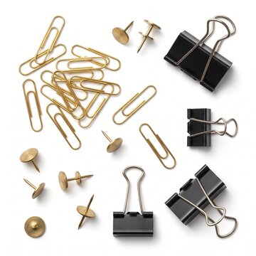 Gold paper clips and black binder clips on white background. Brass thumb tacks and office supplies. Professional stationery set for business.