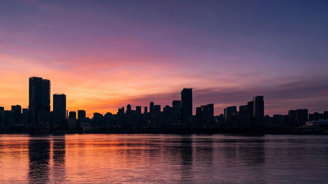 Violet zenith over an orange horizon city