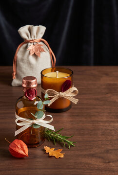 Autumn-themed wedding favors with candles and decorative elements  