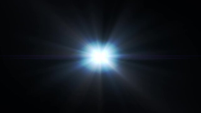 A bright light burst with radiant flare and colorful rays emanating into the dark space