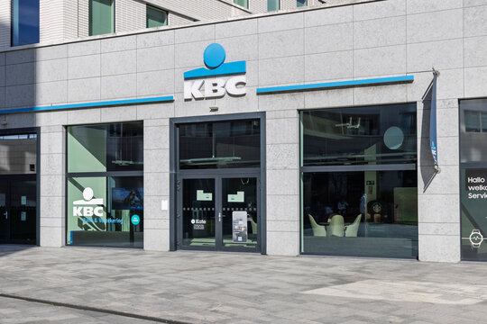 Antwerp, Belgium - September 06, 2026: Exterior view of a KBC bank branch entrance and logo. KBC is a major Belgian universal multi-channel bank and insurance company.