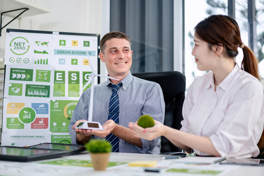 Adult Professionals Collaborating on Sustainable Business ESG Fr