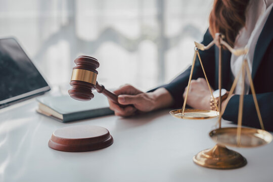Gavel and Scales of Justice with Adult Asian Woman Lawyer in Cou