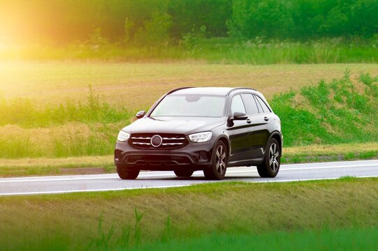 Modern crossover car on scenic rural route