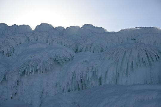 The icy rocks of the cape of the Mare's Head peninsula on Lake Baikal. Eastern Siberia. Russia