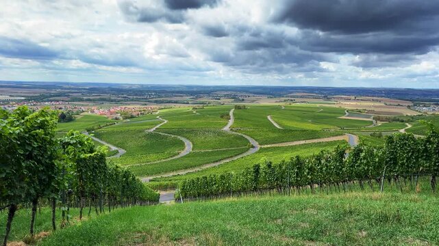 Wide Angle Landscape Shot of Green German Vineyard Hills with Winding Country Roads and Cloudscape 4K