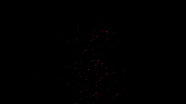 Dark red particle explosion against black background. Abstract glowing dust floating in darkness. Dynamic motion capture of floating embers and spark fragments. Cinematic visual effects overlay