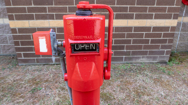 Red Post Indicator Valve PIV Exterior Fire Protection Control Unit Ground Level Commercial Building