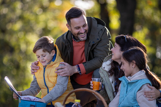 Family enjoys picnic in forest