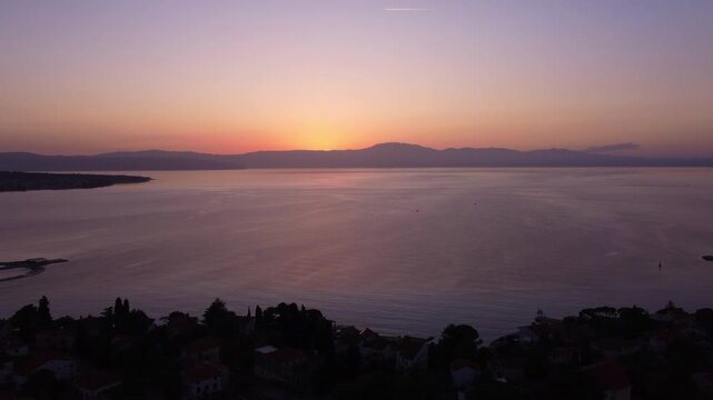 Aerial Pullback Over the Adriatic Sea with Cres Island at Sunset, Malinska, Croatia