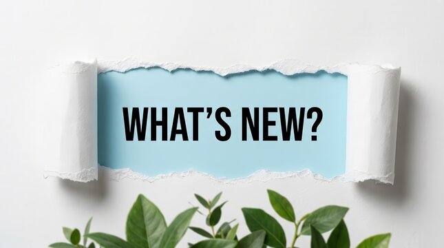 Torn paper reveals What's New text against a blue background with green foliage.