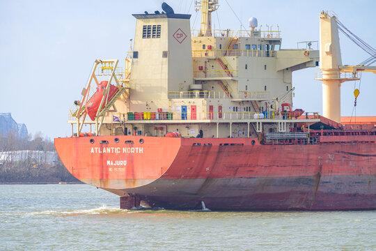 New Orleans, LA, USA - February 20, 2026: Stern of Atlantic North Cargo Ship Travelling Upriver in the Mississippi River 