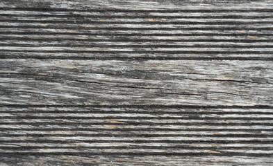 Fototapeta premium Old gray wood background, embossed, textured rustic plank surface.