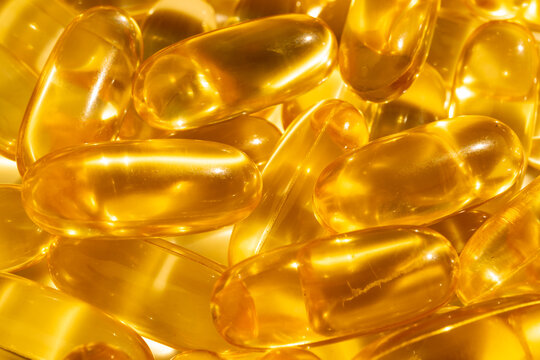 Omega 3 yellow gel capsules, vitamin d bg