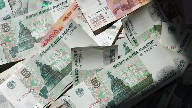 Paper banknotes of Russian rubles of different denominations in a stack close-up
