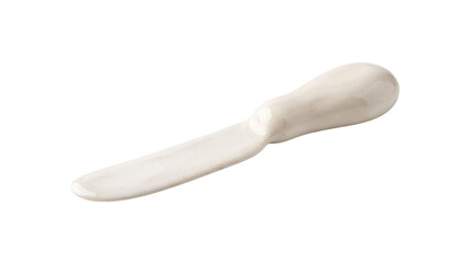 Fototapeta premium Handmade ivory ceramic butter knife with a smooth glazed blade and rounded sculptural handle, featuring subtle artisanal imperfections and refined tableware design. Isolated on White background.