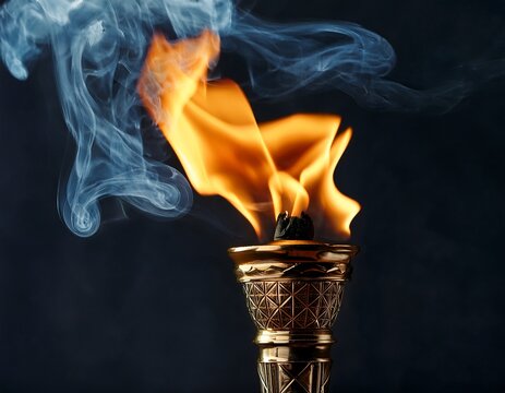 burning torch with flames and smoke against a dark background a symbol of hope freedom and strength