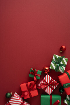 Merry Christmas red vertical background with wrapped presents and ribbons for a happy New Year