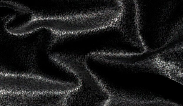 Luxury crumpled black leather texture with natural folds and fine grain detail