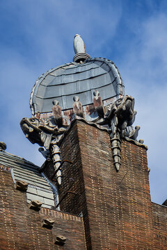 Ornate brick facade of the historic Shipping House (Scheepvaarthuis). It currently houses a Grand Hotel Amrath Amsterdam. Amsterdam, The Netherland. September 12, 2026.