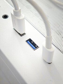 Close Up View of White USB Cables Connected to White PC Case Panel