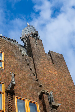 Ornate brick facade of the historic Shipping House (Scheepvaarthuis). It currently houses a Grand Hotel Amrath Amsterdam. Amsterdam, The Netherland. September 12, 2026.