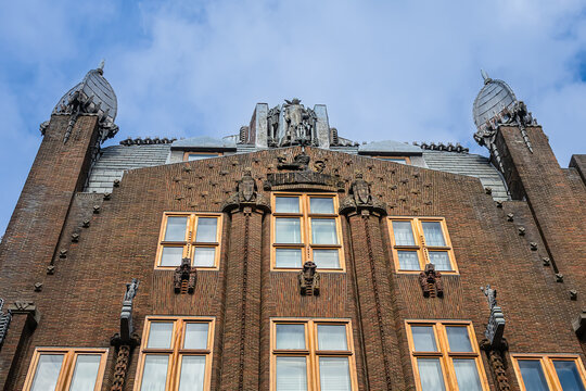 Ornate brick facade of the historic Shipping House (Scheepvaarthuis). It currently houses a Grand Hotel Amrath Amsterdam. Amsterdam, The Netherland. September 12, 2026.