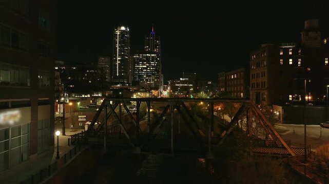 Night view of Denver with bridge and river drone video Colorado 4K
