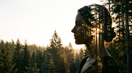 Double exposure portrait silhouette blended with sunlit pine forest, representing mental health, mindfulness, healing, nature connection and emotional wellbeing. © Khaw