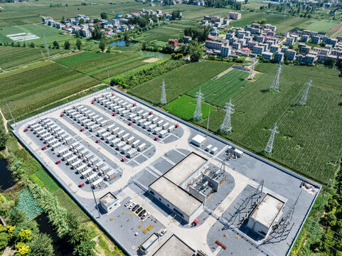 aerial view of large scale energy storage power station in green fields