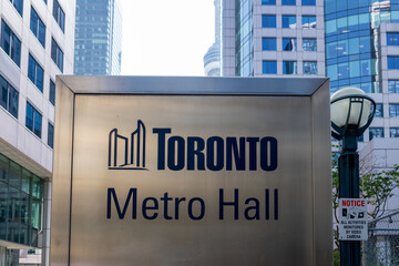 Obraz premium Toronto, Ontario, Canada -September 13, 2026: Closeup Toronto Metro Hall sign on John Street in downtown Toronto, Ontario, Canada. 
