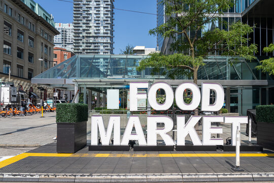 Toronto, Ontario, Canada - September 13, 2026: A large white "FOOD MARKET" exterior sign on King Street West in downtown Toronto,  Ontario, Canada.