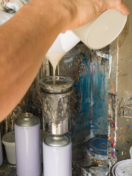 Manufacturing automotive aerosol paint cans in workshop