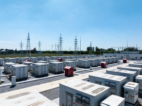 Large outdoor energy storage power station battery container array under blue sky