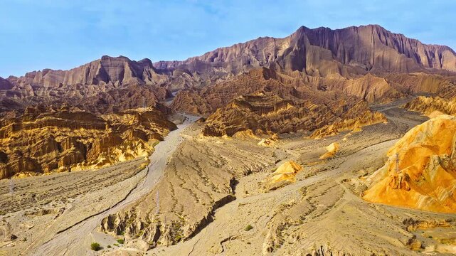 Aerial view of massive arid canyon landscape and rugged rocky ridges in Kuqa, Xinjiang, China