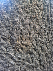 Close-Up View Showing the Rough Weathered Surface and Natural Stone Texture of a City Square Bench © treeprasetyo