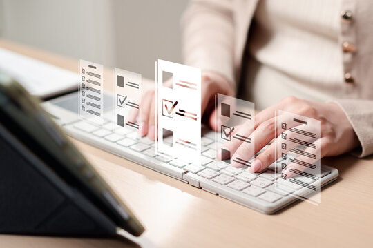 Business survey questionnaire checklist and data entry evaluation. Woman hands typing on computer keyboard filling form document.