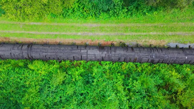 Summer aerial view featuring the 3.4 mile long wooden penstock in Vermont known as The Snake that runs from the Searsburg Dam to a generating station along the Deerfield River with an 8 foot diameter