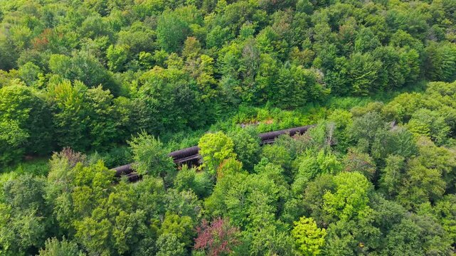 Summer aerial view featuring the 3.4 mile long wooden penstock in Vermont known as The Snake that runs from the Searsburg Dam to a generating station along the Deerfield River with an 8 foot diameter