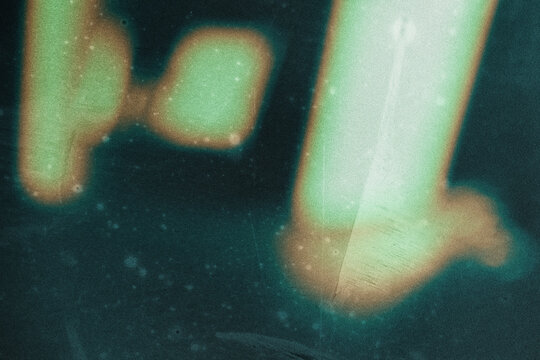 grainy colorful warm orange light leaks on black background with dust texture. abstract damaged scratched retro film analog effect for using over photos as overlay or screen filter