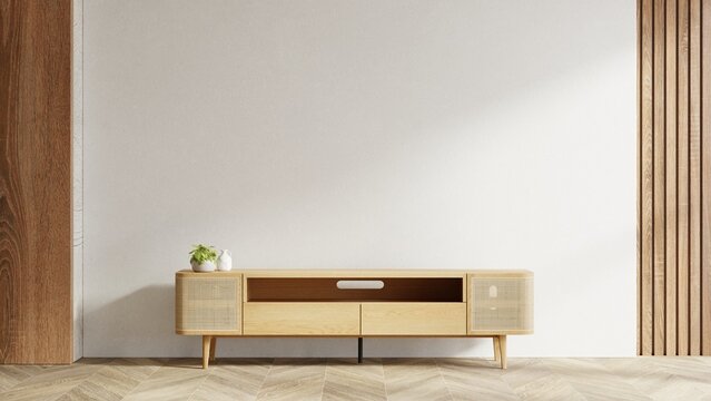 Minimalist wooden TV console with rattan doors against a blank wall- 3D rendering
